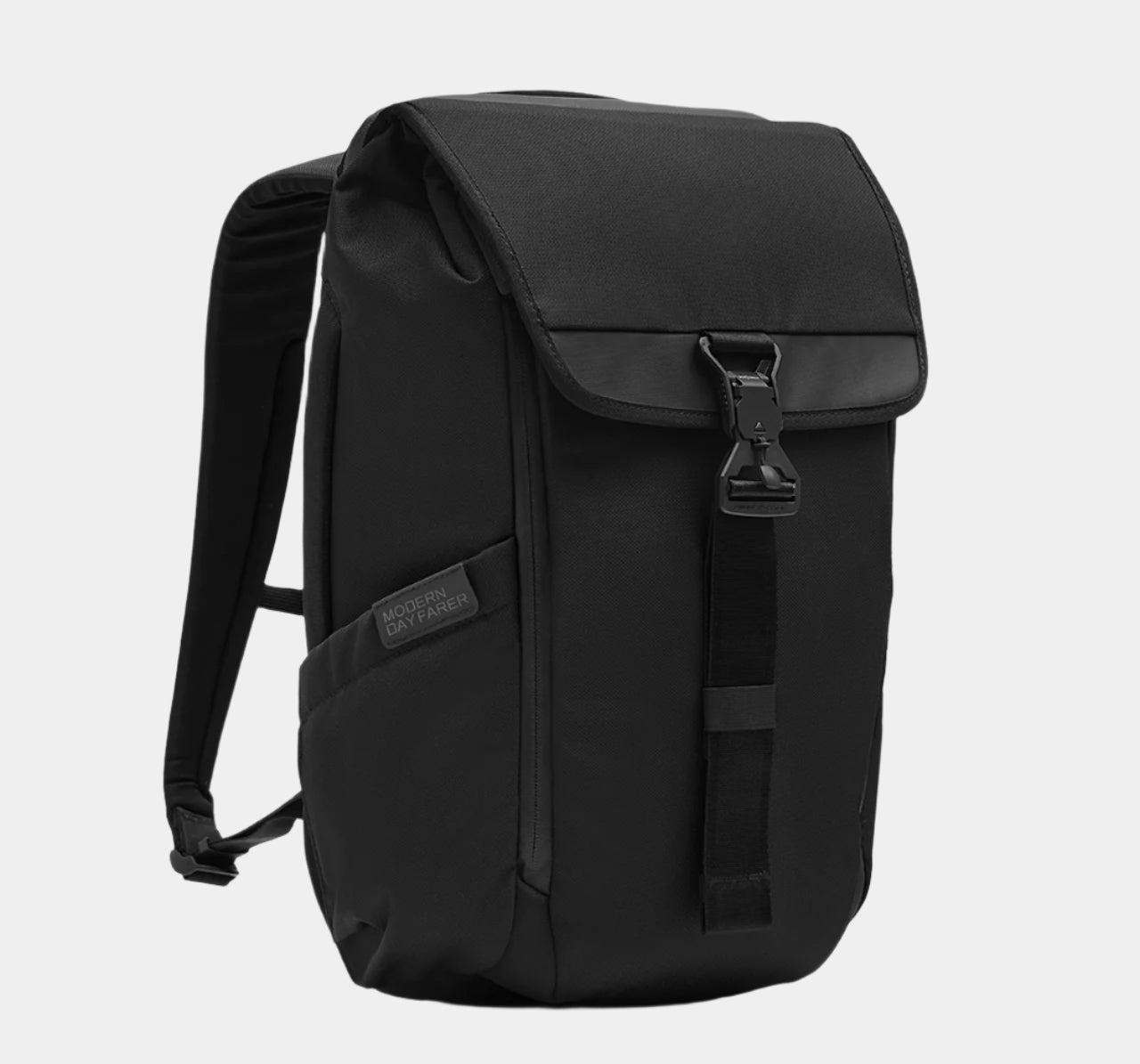 Front left view of the MODERN DAYFARER Backpack 18L in black, showing logo detail