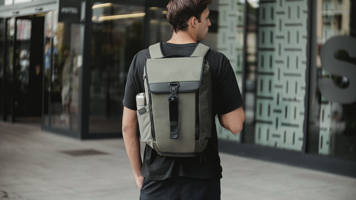 The Olive DAYFARER Backpack 24L worn in the city