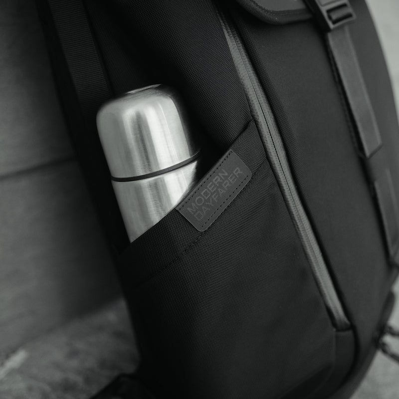 "DAYFARER V2 Backpack - Expandable water bottle pocket"